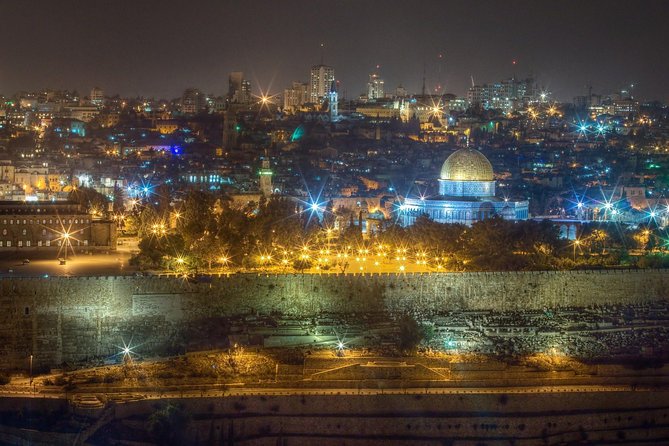 The Old City of Jerusalem after dark, the golden dome lit at its centre